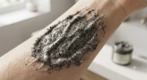 Texture swatch of an exfoliating face scrub for blackheads showing natural cleansing granules.